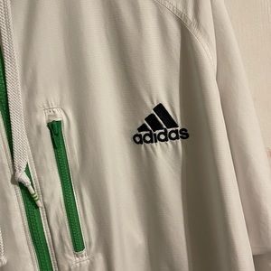Very nice Adidas windbreaker. Rain proof. Hoodie. Net lining.